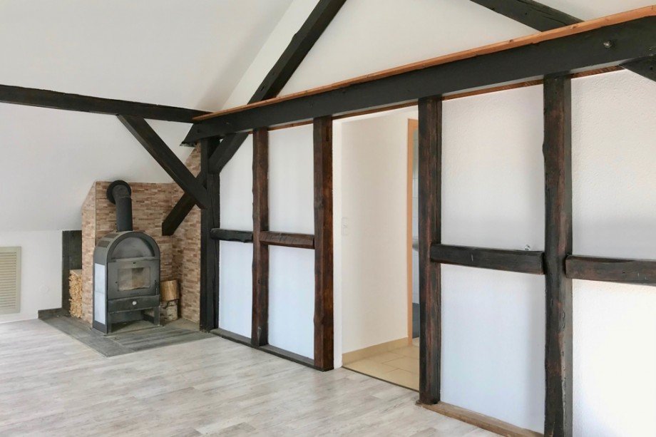 Wohnzimmer mit Kamin Dachgeschosswohnung Udestedt